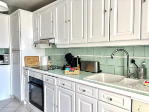 Η κουζίνα ή μικρή κουζίνα στο Vivez au large dans ce grand T3