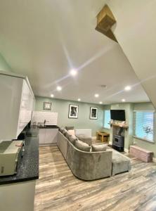 a living room with a couch and a table at New Cosy three bedroom house in Ballingarry Limerick Near Adare in Limerick