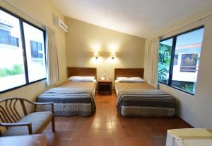 Cama ou camas em um quarto em SINA SUITES CANCUN - Adults Only mais 37 fotos