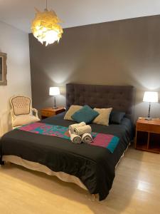 a bedroom with a bed with two stuffed animals on it at Vue exceptionnelle sur les Tours ! Charme et tranquillité in La Rochelle