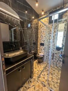 a bathroom with a sink and a shower at #ALS-On Air Luxury Rooftop in Mesochórion