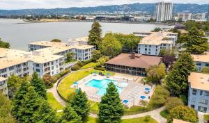 an aerial view of an apartment complex with a swimming pool at Nice place surrounded by the water in Emeryville