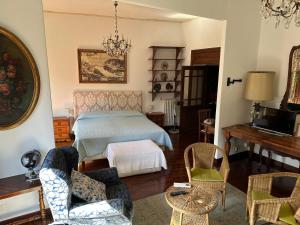 a bedroom with a bed and a table and chairs at Catherine's Home in Rome