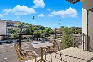 a patio with a table and chairs on a balcony at Scottsdale - 1501 N Miller Rd #1015 in Scottsdale