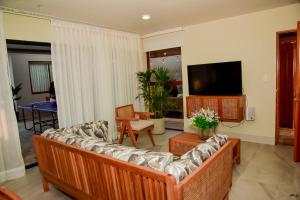 TV a/nebo společenská místnost v ubytování Casa Campo-Playa Sand in My Shoes