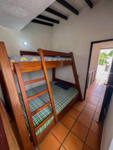 a bedroom with two bunk beds in a room at Casa Vacacional en San Jerónimo, Antioquia in San Jerónimo +12 photos