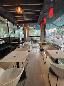 a dining room with tables and chairs in a restaurant at Rara HM in Male City