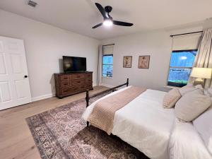 a bedroom with a bed and a flat screen tv at Spacious Roanoke Retreat in Roanoke