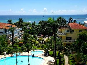 an aerial view of a resort with a swimming pool and the ocean at Brisa de Mar in Boca Chica
