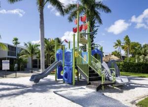 a playground at a resort with a slide at Tropical 2BR2BA Getaway in Gorgeous Key Largo, Marina, Saltwater Lagoon, Pool in Key Largo