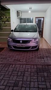 a white car parked in a garage at Casa 5 estrelas in Cascavel