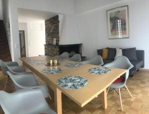 a dining table and chairs in a living room at Western in Mörfelden-Walldorf