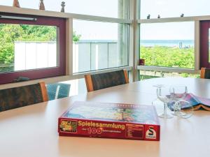 a pizza box sitting on top of a table with glasses at 8 person holiday home in Glesborg in Fjellerup +21 photos
