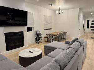 a living room with a couch and a table at Mountain Pines Getaway in Flagstaff