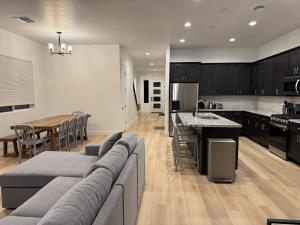 a kitchen and dining room with a couch and a table at Mountain Pines Getaway in Flagstaff
