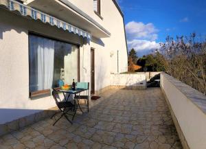 a table and chairs sitting outside of a building at Western in Mörfelden-Walldorf