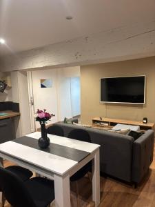 a living room with a couch and a table at TheNest in Vienne