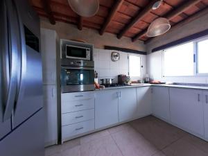 Kuchyň nebo kuchyňský kout v ubytování Casa on the rock's + 13 fotografií