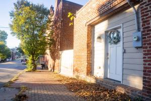 a brick building with a door on the side of a street at Centrally-Located Studio in DWTN Richmond in Richmond