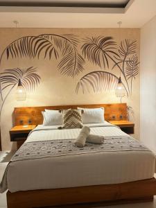 Postel nebo postele na pokoji v ubytování Santai Suites Nusa Dua