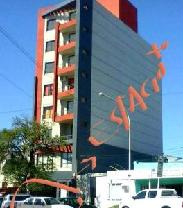 a large building with a painting on the side of it at Paraná Suite Alem in Paraná