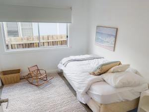 a bedroom with two beds and a window at Coastal Bliss - 200m to beach in Rosebud
