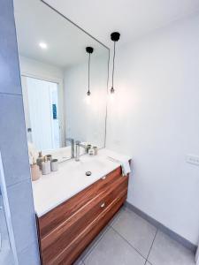 a bathroom with a sink and a mirror at Coastal Bliss - 200m to beach in Rosebud +17 photos