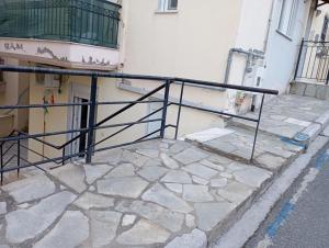 a black railing on the side of a building at Studio Castra in Thessaloniki
