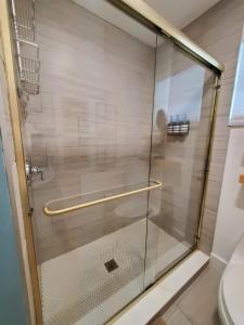 a shower with a glass door in a bathroom at Saltwater Lagoon Front View, Marina, Kayaks in Key Largo