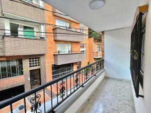an empty balcony of a apartment with a building at New apart steps from CC Mayorca in Sabaneta