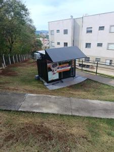 a ping pong table sitting on the grass at Apartamento WJM in Espirito Santo Do Pinhal