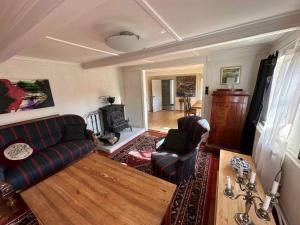 a living room with two couches and a table at 5 star holiday home in Søby Ærø in Søby