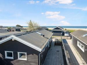 an aerial view of a house and the beach at 5 star holiday home in Karrebæksminde in Karrebæksminde