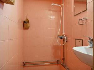 a pink bathroom with a shower and a sink at 5 star holiday home in Vesterborg in Vesterborg