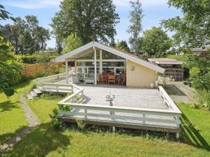 a house with a deck and a building at 5 star holiday home in Strøby in Strøby Ladeplads