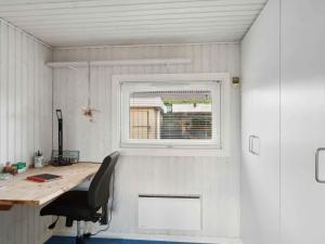 an office with a desk and a window at 5 star holiday home in Strøby in Strøby Ladeplads