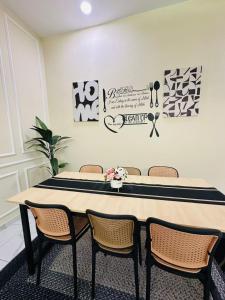 a dining room with a table and chairs at WanZa House in Bachok +10 photos