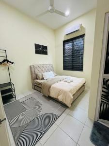 a bedroom with a bed and a window at WanZa House in Bachok