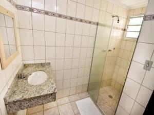 a bathroom with a sink and a shower at Don Carlo Hotel in São Bernardo do Campo +32 photos