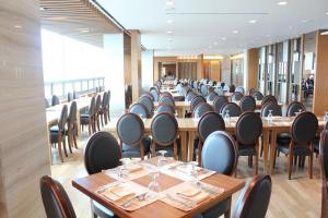 a row of tables and chairs in a restaurant at The Class 300 in Sokcho