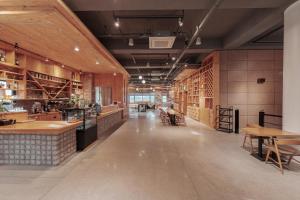 a large room with tables and chairs in a building at Jeonju Yeonghwa Hotel in Jeonju