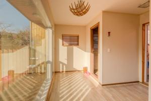 an empty living room with a glass wall at Hwasun Byeolsan Pension in Wajun