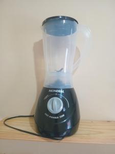 a blender sitting on top of a table at Casa em Nova Iguaçu in Nova Iguaçu