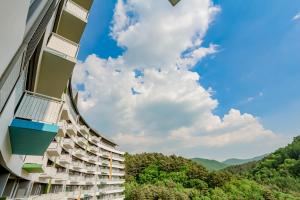 a building with balconies on the side of it at Pyeongchang I-One Resort in Pyeongchang
