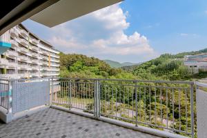 a balcony with a view of the mountains at Pyeongchang I-One Resort in Pyeongchang