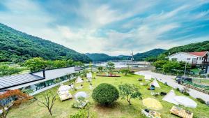 an aerial view of a resort with a park at Glamdog Dog Pension Tongyeong Branch in Wŏnmul-li
