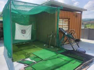 a batting cage with a flag in it at Choongju Garden Arirang Pension in Chungju