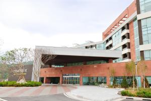 an office building with a courtyard in front of it at Mungyeong Saejae Resort in Mungyeong