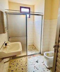 a bathroom with a sink and a toilet at Apartamento praia do farol in Mosqueiro
