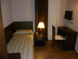 Postel nebo postele na pokoji v ubytování Hotel Le Badie